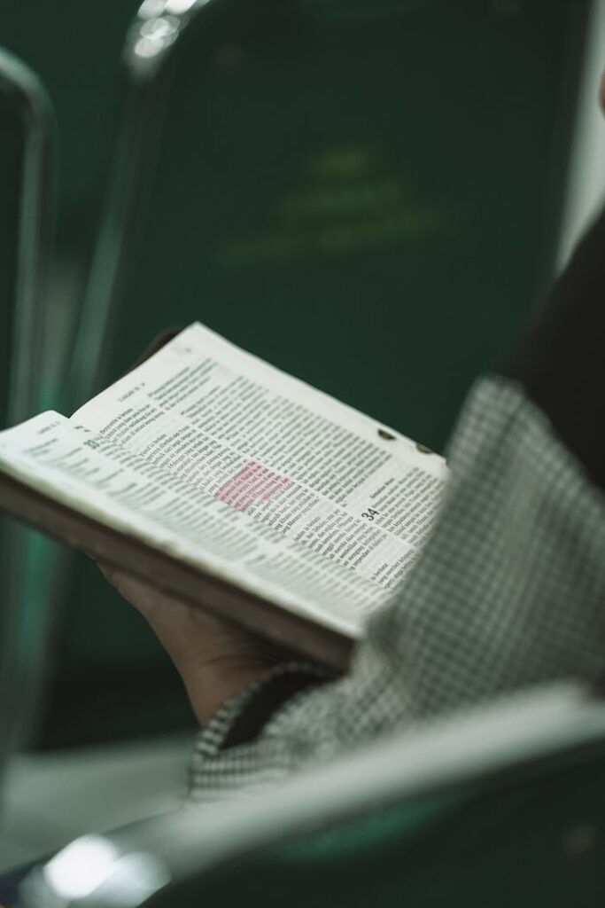 pexels photo 29179298 Person holding a Bible during a religious study session in West Java, Indonesia.