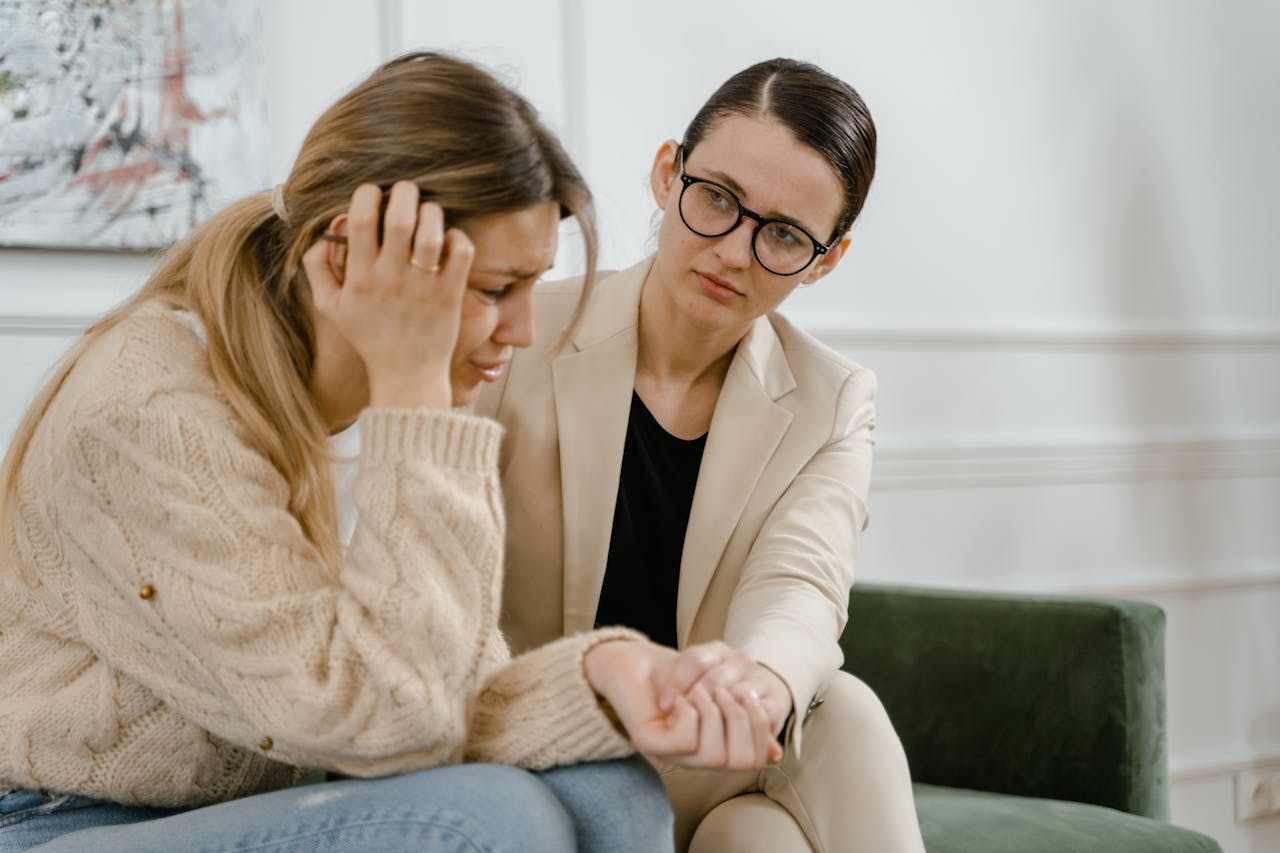Crafting Captivating Headlines: Your awesome post title goes here A woman receives counseling from a professional, showcasing empathy and mental health support.